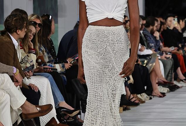 Naomi Campbell flashed her toned abs in a beaded skirt at star-studded Ralph Lauren show in Bridgehampton in New York on Thursday
