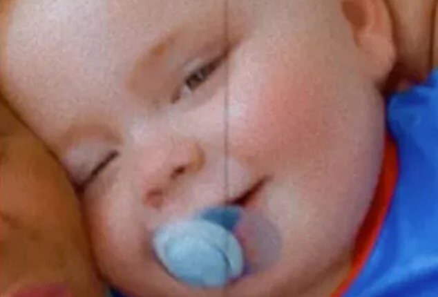 The toddler, whose name was today confirmed by a coroners' court as Carter Walsh (pictured), was fatally injured at his home in Wigan, Greater Manchester when a fireplace fell on him