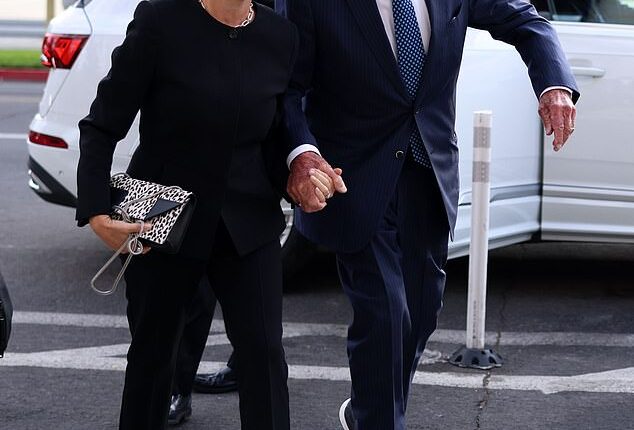 Rupert Murdoch arrives for a court battle over the future of his media empire, holding hands with his fifth wife, Russian biologist Elena Zhukova