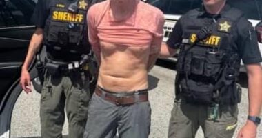 Ryan Wesley Routh, the gunman accused of trying to kill Donald Trump on Sunday, appeared in federal court appearance with his hands and feet in shackles on Monday. Pictured: Police released on Monday an image of Routh's arrest after he was able to flee 50 miles from Trump International Golf Club
