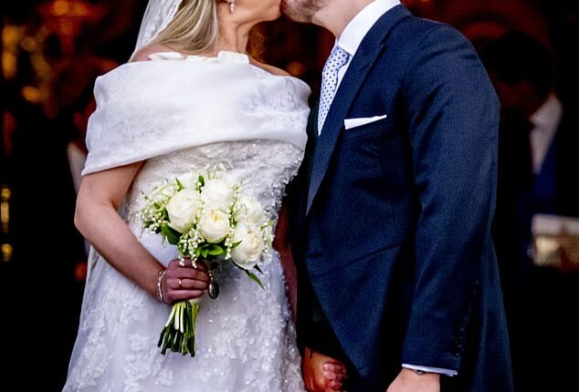 Princess Theodora and Mathew Kumar lovingly share a smooch as they leave the Cathedral