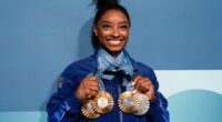 Simone Biles corrects a sign that miscalculated her number of gold medals
