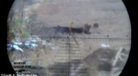 In the footage, which appears to be filmed through the sniper's scope, the brave Ukrainian soldier appears ready to shoot at enemy targets
