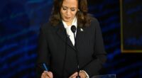 US Vice President and Democratic presidential candidate Kamala Harris takes notes as former US President and Republican presidential candidate Donald Trump speaks during a presidential debate