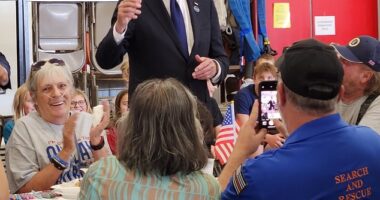 President Joe Biden briefly sported one of former President Donald Trump 's red MAGA hats in a move the White House said was to show 'bipartisan unity'