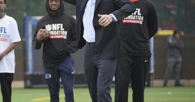 Prince William was spotted wearing a very bright pair of trainers with his suit as he visited the NFL Foundation in London on Tuesday