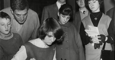 Paul Keres, in the middle looking down at the board, contested the title in a tournament split between The Hague in the Netherlands and Moscow