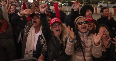 Supporters of Republican presidential nominee former President Donald Trump react as Elon Musk takes stage during a campaign rally at Madison Square Garden, Sunday in New York