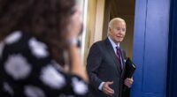 US President Joe Biden jokes with the news media as he walks from the daily briefing in the White House press briefing room