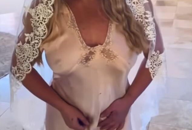 baffled fans by declaring she 'married' herself while posing in a wedding dress and veil, one year after her divorce from Sam Asghari