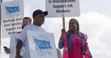 European shipping firm shares drop as dockworkers temporarily end U.S. port strikes