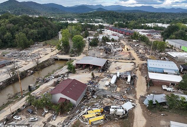 An aerial view of flood damage wrought by Hurricane Helene along the Swannanoa River on October 3, 2024 in Asheville, North Carolina. FEMA and other emergency-management whistleblowers allege the agency wasted funds, withheld pre-disaster aid and was slow to deploy first responders and service members to help with recovery efforts