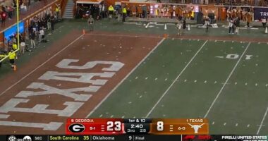 Furious Texas fans threw bottles onto the field after a controversial call against Georgia