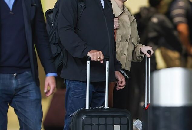 Gregg Wallace kept a low-key figure under a black baseball cap as he landed in the UK with wife Anne-Marie Sterpini on Monday after a four-day getaway to Italy