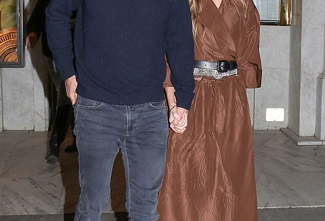 Hilary Swank put on a loved-up display with her handsome husband Philip Schneider as they stepped out for the Miu Miu afterparty during Paris Fashion Week on Tuesday night