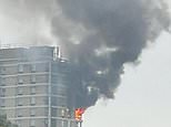 Huge fire at block of flats in East London as ten fire engines and 70 firefighters race to scene