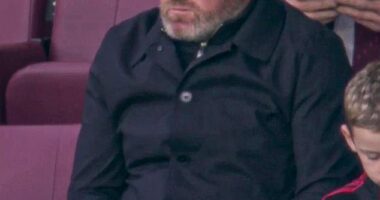 Wayne Rooney pictured watching his old club lose to Tottenham on Sunday evening - the former England and Manchester United striker's appearance left some fans concerned