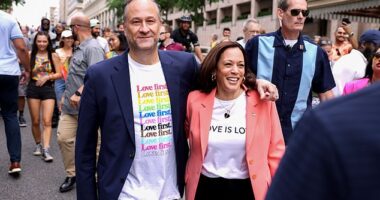 Doug Emhoff has been previously dubbed by Democrats as a 'wife guy' and a 'mensch', a Yiddish term for an honorable, kind man. He is pictured marching with wife Kamala at the Capitol Pride Parade in 2021