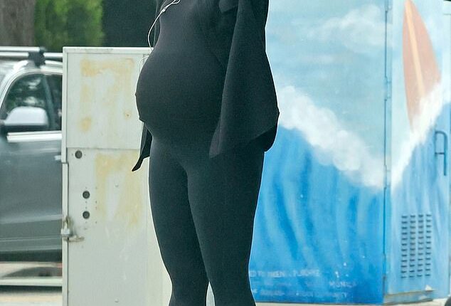 Pregnant Katherine Schwarzenegger showed off her growing baby bump while stepping out for some fresh air in Los Angeles on Wednesday afternoon
