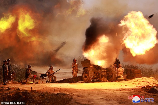 A view shows the live ammunition shooting training of the graduates of the 75th class of O Jin U Artillery Academy, in progress, at an undisclosed location, in North Korea