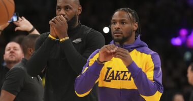 Los Angeles Lakers forward LeBron James, left, and guard Bronny James warm up Tuesday
