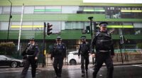 Police outside Westminster Academy on Tuesday after a suspected acid attack left a 14-year-old girl with severe injuries