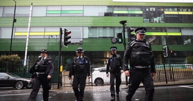 Police outside Westminster Academy on Tuesday after a suspected acid attack left a 14-year-old girl with severe injuries