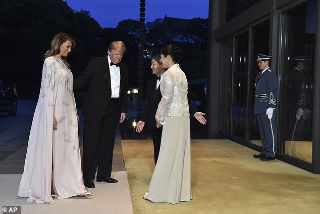 Donald and Melania Trump are greeted by Japan's Emperor Naruhito and Empress Masako upon their arrival at the Imperial Palace for a state banquet in May 2019