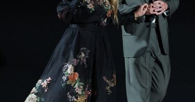 Nicholas Hoult looked handsome in a grey suit as he joined his stylish co-star Toni Collette for the Juror #2 premiere on Sunday