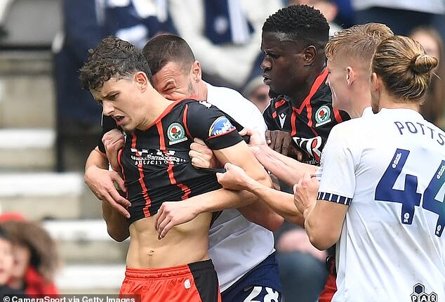 Milutin Osmajic (second left) pictured biting Owen Beck (left) during a game last month