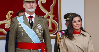 King Felipe of Spain (pictured, left) and Queen Letizia (pictured, right) were snapped attending a military parade known as Dia de la Hispanidad in Madrid om Saturday