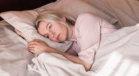 Women aged between 40 and 60 get an average of just 6 hours and 36 minutes of sleep per night due to frequent insomnia and night sweats, a study shows (stock image)