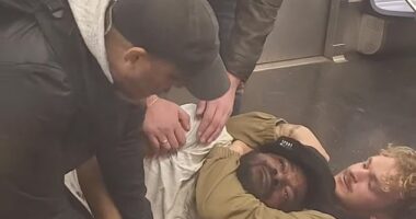 Penny held Neely in a chokehold on the subway car floor while others assisted on May 1, 2023