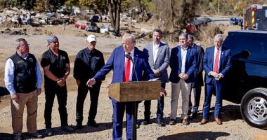 Former president and Republican presidential nominee Donald Trump comments on relief efforts with local leaders during a tour of Hurricane Helene devastation in Swannanoa, North Carolina, 21 October 2024.
