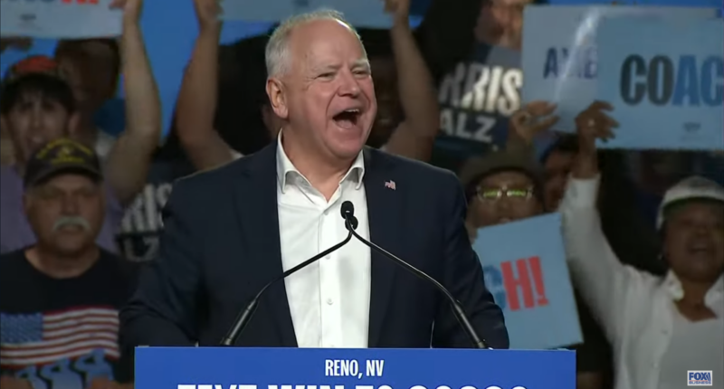 Tim Walz speaking at a campaign rally.