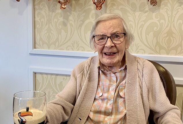 Kathleen Hennings (pictured) credited her long life to Guinness as she marked the milestone with loved ones and her favourite drink at Care UK's Sandfields Care Home on October 2