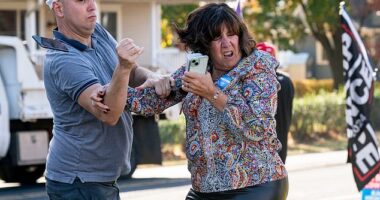 A Trump supporter, left, gets into a confrontation with a Harris fan outside an event for Tim Walz in Bristol Township, Pennsylvania, last week.