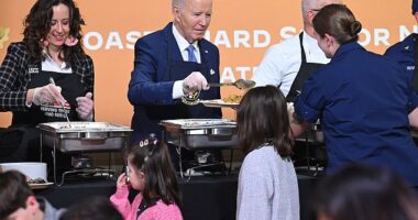 82-year-old President Joe Biden joked about his age - and getting 'fired' - as he served up Brussels sprouts at a Coast Guard 'Friendsgiving' Monday night on Staten Island