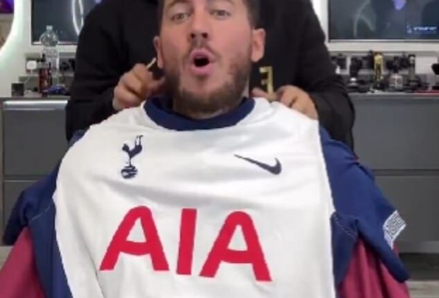Eden Hazard was unimpressed as Ahmed Alsanawi, the owner of A Star Barbers, draped him in a Tottenham kit
