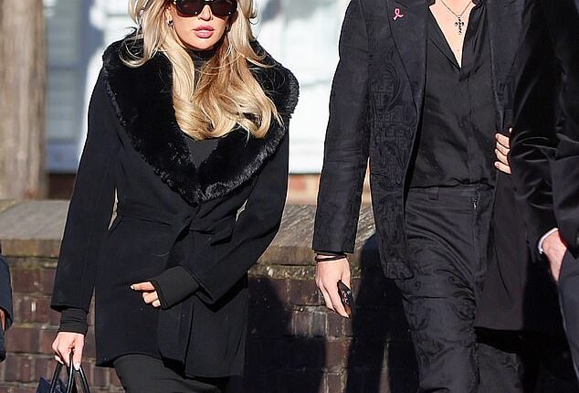 Liam Payne's girlfriend Kate Cassidy, 25, arriving at the church for the singer's funeral today alongside Damian Hurley, 22