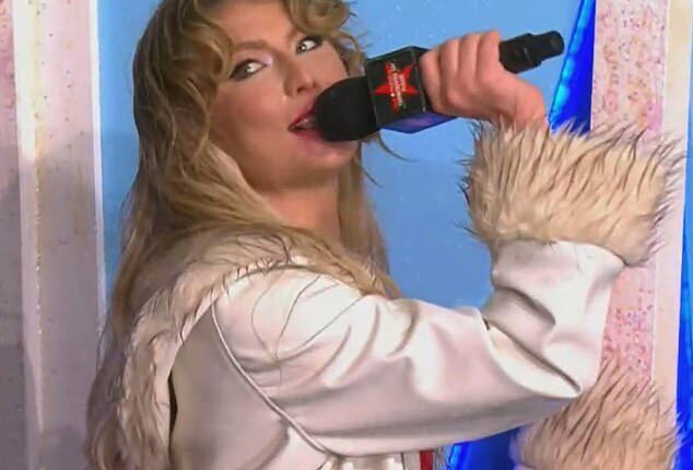 Dasha's red lipstick smudged down her chin during her Macy's Thanksgiving Parade set