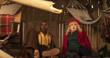 The Doctor and Joy sitting on the floor looking scared in Doctor Who Christmas special Joy to the World