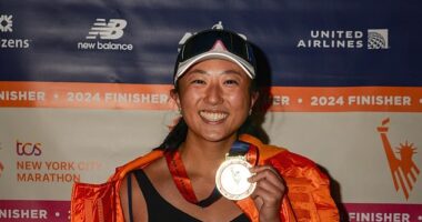 Justine Huang, a seasoned marathoner, decided she was going to 'slow down and interact with spectators' as she finished the 26.2 mile run on November 3