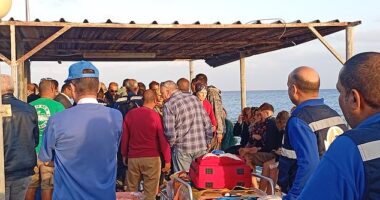 Medics and people wait for possible survivors after a boat sank at a harbour in Marsa Alam, Red Sea Governorate, in Egypt, 25 November 2024