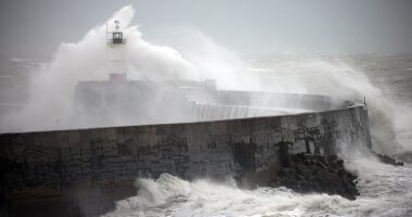 Strong winds, waves and rain brought by Storm Bert at Newhaven in West Sussex yesterday