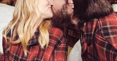 Kate Hudson shared a kiss with her fiancé Danny Fujikawa for their annual holiday card in new pictures released on Instagram on Thursday