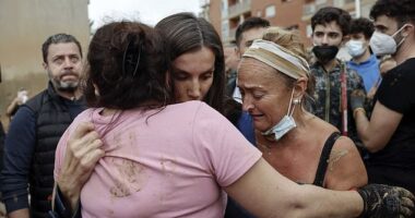 Spain's Queen Letizia consoles a woman during her visit to Paiporta, eastern Spain, November 3, 2024