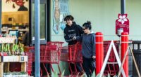 Kourtney Kardashian 's eldest child - son Mason Disick, 14 - towered over her while stepping out on a grocery run in Los Angeles