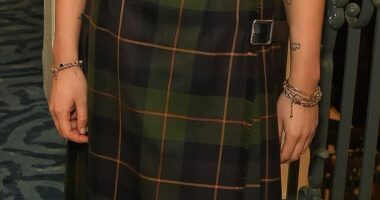 Amelia put her best fashion foot forward and stepped out in a forest green belted tartan maxi skirt, one of the hottest trents of the season