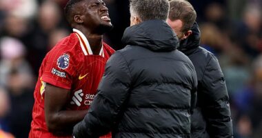 Liverpool dealt huge injury blow as in-form Ibrahima Konate leaves the field in AGONY during clash with Brighton... with defender forced to use his shirt as a makeshift sling